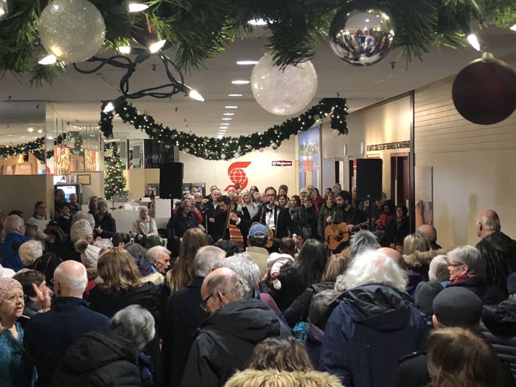 mylesdavid's tweet photo. Holy smokes!! #Fredericton comes through with its biggest total ever. $6320 raised for local food banks!! Well done. What a day in @DowntownFred at King's Place. Thanks everyone. (I definitely see the top of my Uncle David's head here! What a sweet white mop he's got.) https://t.co/6cVhQAuG4H