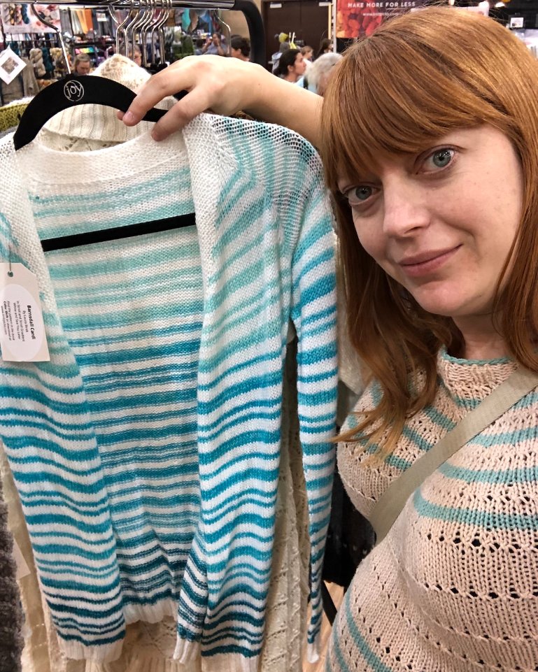 BFPpodcast's tweet photo. Did you all know that Laura is a professional knitter!? In Ep. 23, she talks about scoring big on baby yarn at the yarn convention. Here she is at the convention with one of her designs that was on view. #bfppodcast #bfp #pregnancy #knitting #yarn #babyknits #30weekspregnant https://t.co/SV9YIPp9YK