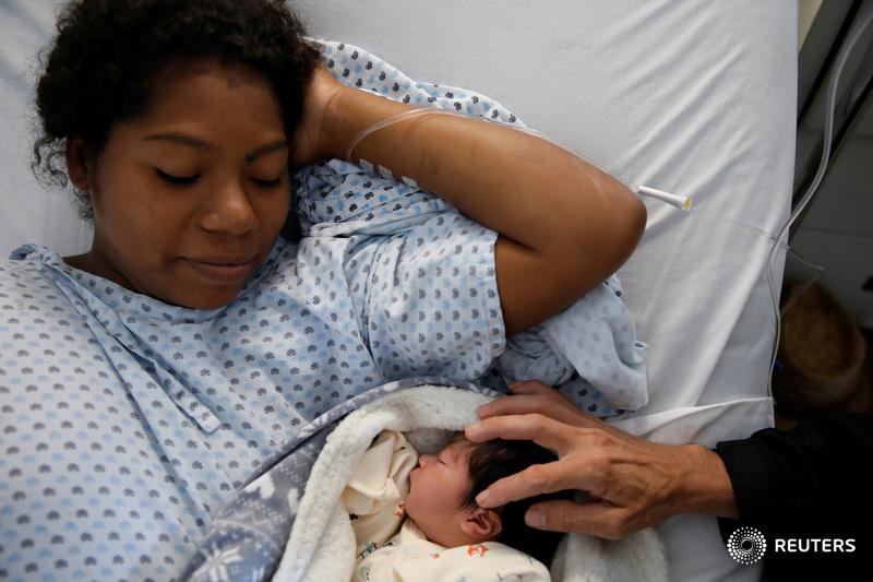 Honduran migrant Erly Marcial, eight months pregnant, joined the U.S.-bound migrant caravan with her family. She gave birth to a healthy baby on the grueling trail and is now hoping for another miracle. More on the Wider Image: https://reut.rs/2Le4e4u @carlosrawlins