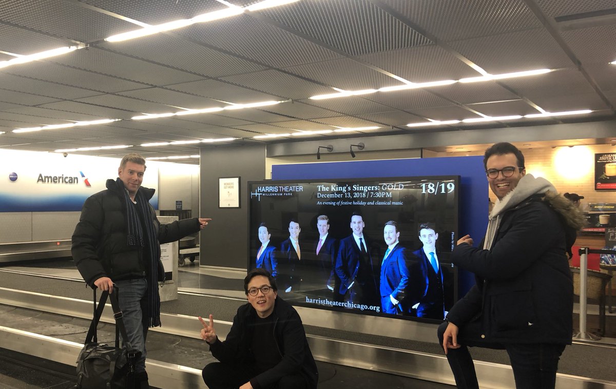 kingssingers's tweet photo. Full marks to .@HarrisTheater #Chicago for advertising. Never seen ourselves whilst waiting at baggage reclaim before! https://t.co/M4nsyxgKVQ