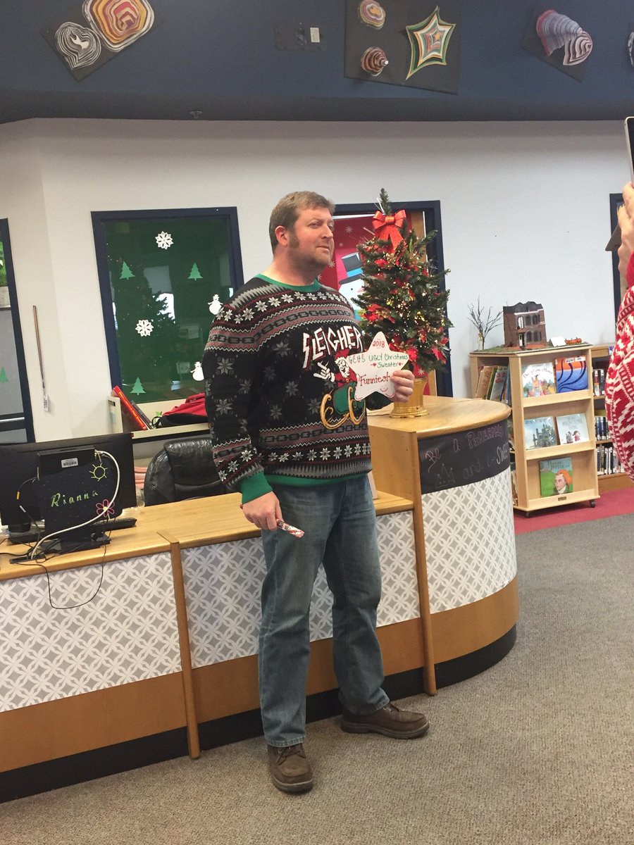 leigh_simpson_'s tweet photo. It was a fun staff meeting today! If you give a GCHS teacher the chance to shine, or to show off their best ugly Christmas sweater, they will impress! 🎄#buildthetribe #WeareGC https://t.co/qh8cQ2vB2T