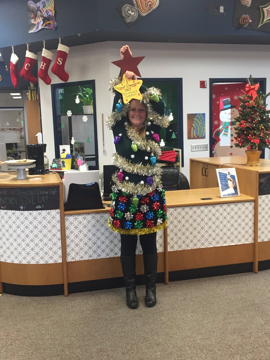 leigh_simpson_'s tweet photo. It was a fun staff meeting today! If you give a GCHS teacher the chance to shine, or to show off their best ugly Christmas sweater, they will impress! 🎄#buildthetribe #WeareGC https://t.co/qh8cQ2vB2T