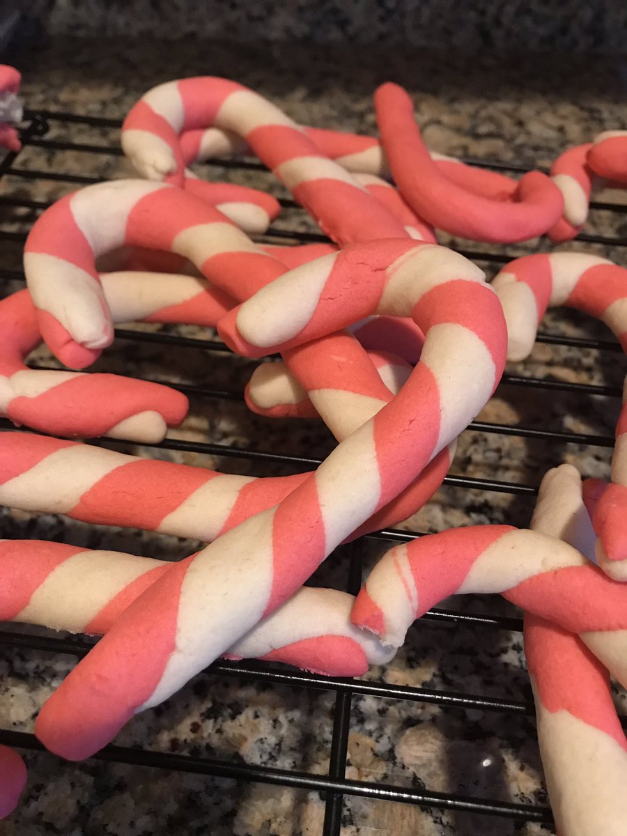 Twisted cookie dough in red and white that form the shape of a Candy cane