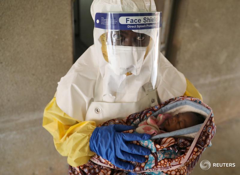 A health care worker carries a baby suspected of being infected with Ebola virus in a hospital in Oicha, and more images from Congo's Ebola zone: https://reut.rs/2QKQOC8 📷 Goran Tomasevic