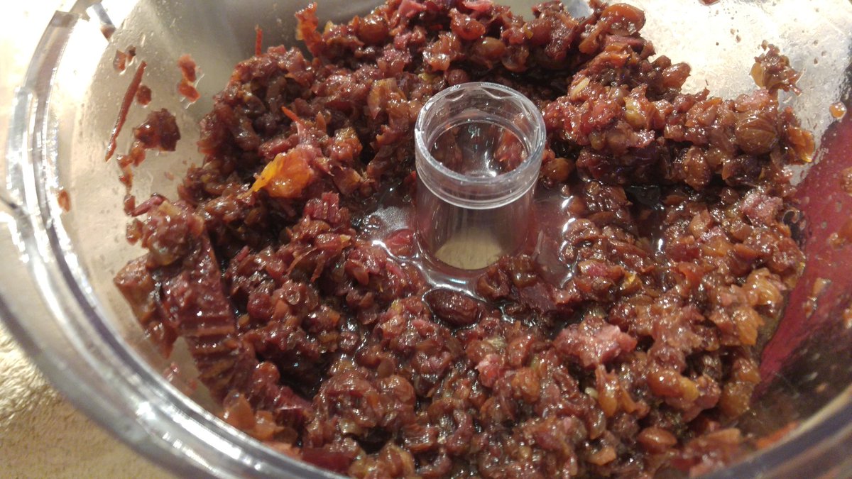 I scoop solids into the food processor and pulse it until it's chunky to break up the fruit. Then I squeeze it in the press.