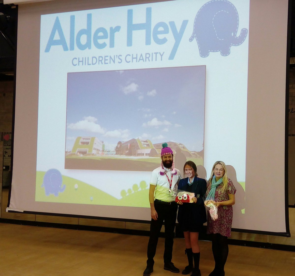 BHCHS_Chaplain's tweet photo. It was great to have @adixonAlderHey and @wigzeewoo in @broughtonhall Y11 Assembly this morning to pass on the wigs we made for @AlderHey in the Summer! It's so lovely to see how the girls hard work will make a difference to children's lives #makemercyreal https://t.co/rCi6CIc0Pn