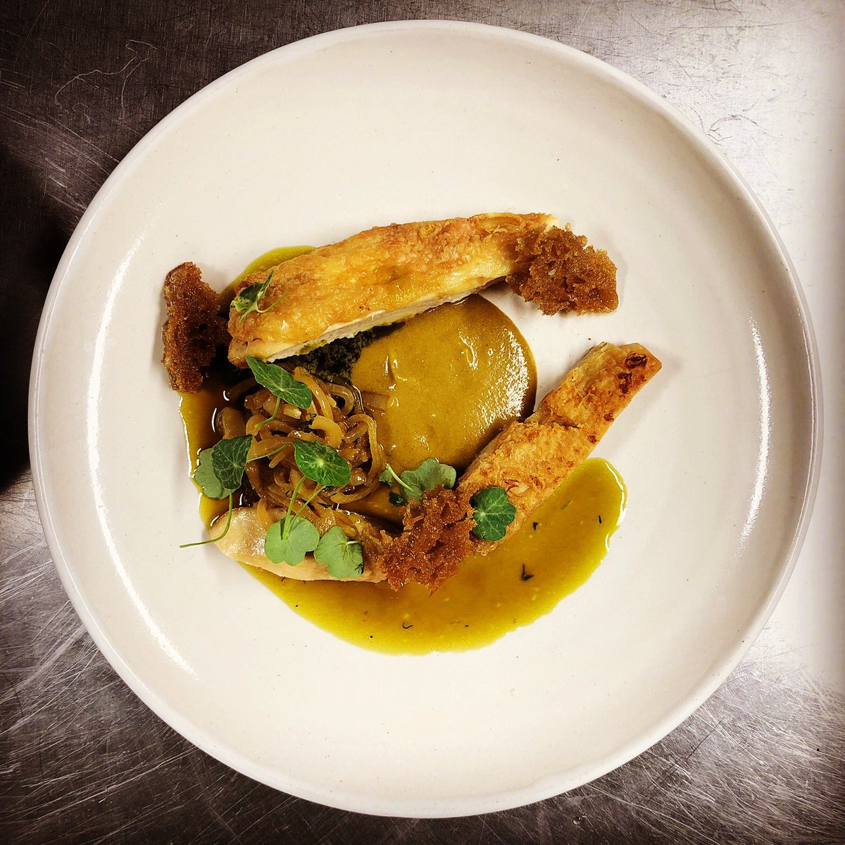 Chic breast and leg, nasturtium sauce made from the flowers, chic fat &amp; glacé, vinegar, sourdough &amp; onions cooked in whey.