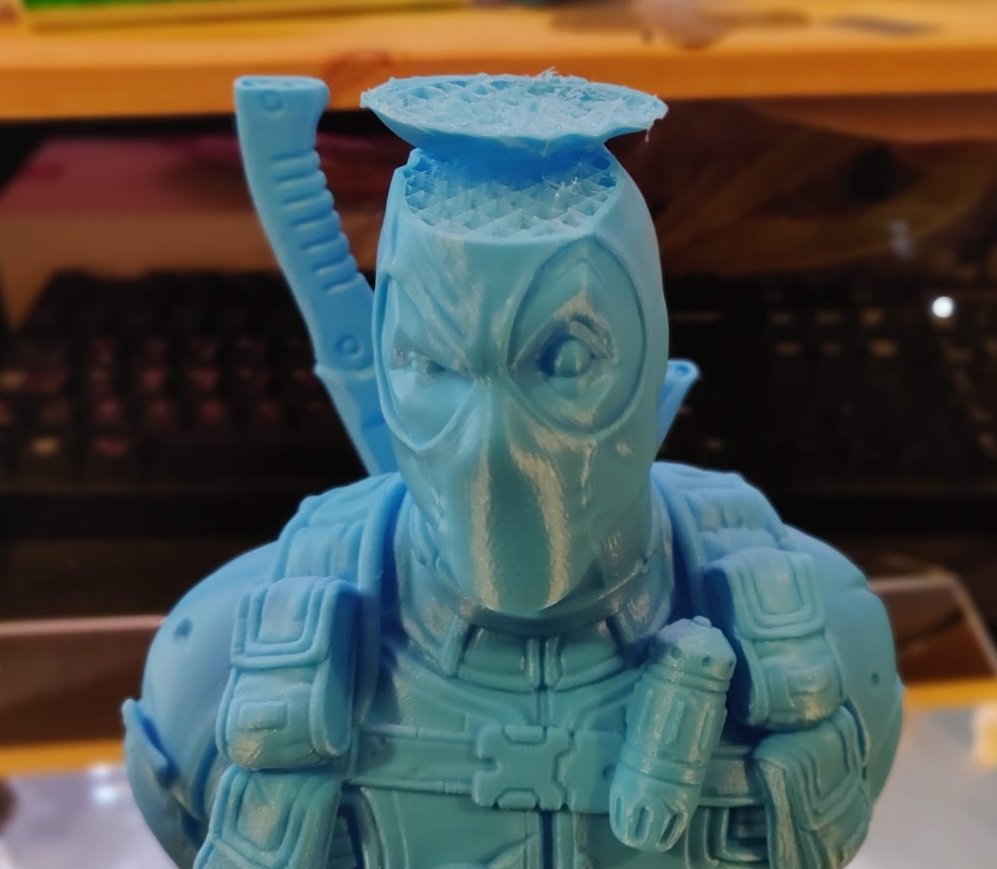 eastman's tweet image. We usually show the best sides of everything on social media, but I think it's also a good idea to get the glimpse of the other side of the coin. Let me present to you "Deadpool Bust (Remastered Director's Cut Edition)", after 37 hours of printing :D #3dprintingfail