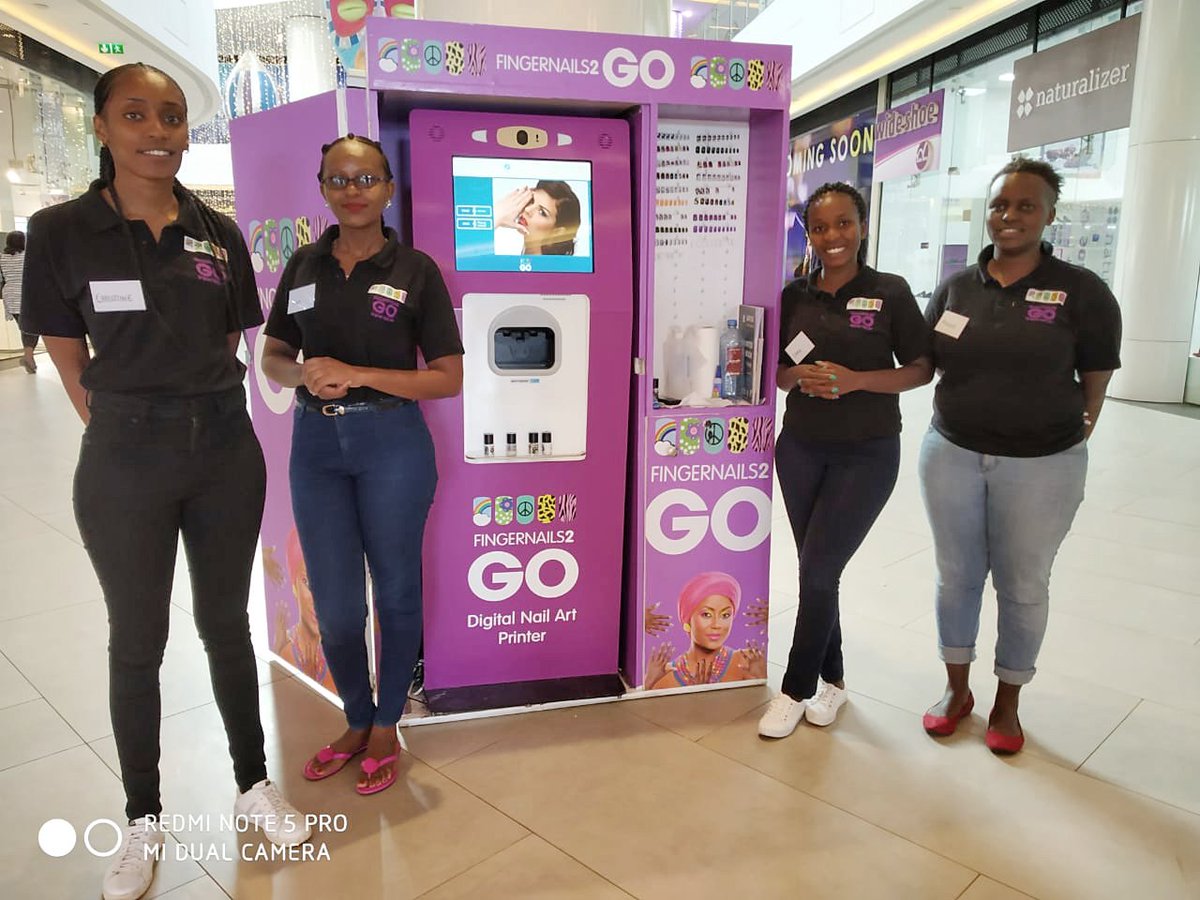 FingerNails2go's tweet photo. We are wishing a warm welcome to our new team in Nairobi who are all set to bring the first Fingernails2Go #digitalnailart kiosk to Africa! Now open at the @TwoRivers_KE mall in Nairobi, Kenya. Come and check us out! 💅 #nailart #futuretech #nailedit #manicure #FN2GO #nailstogo https://t.co/k2JoAwN45h