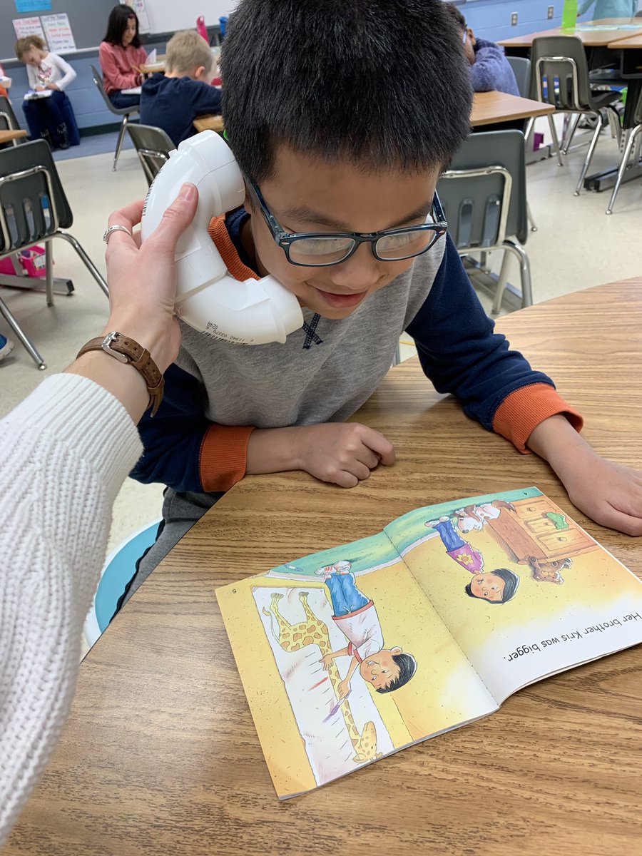 Working on reading fluency with whisper phones is fun...especially when Ms. Davis is holding it for you 🤪 <a href="/SeldensLanding/">seldens.landing.es</a> #SLES19