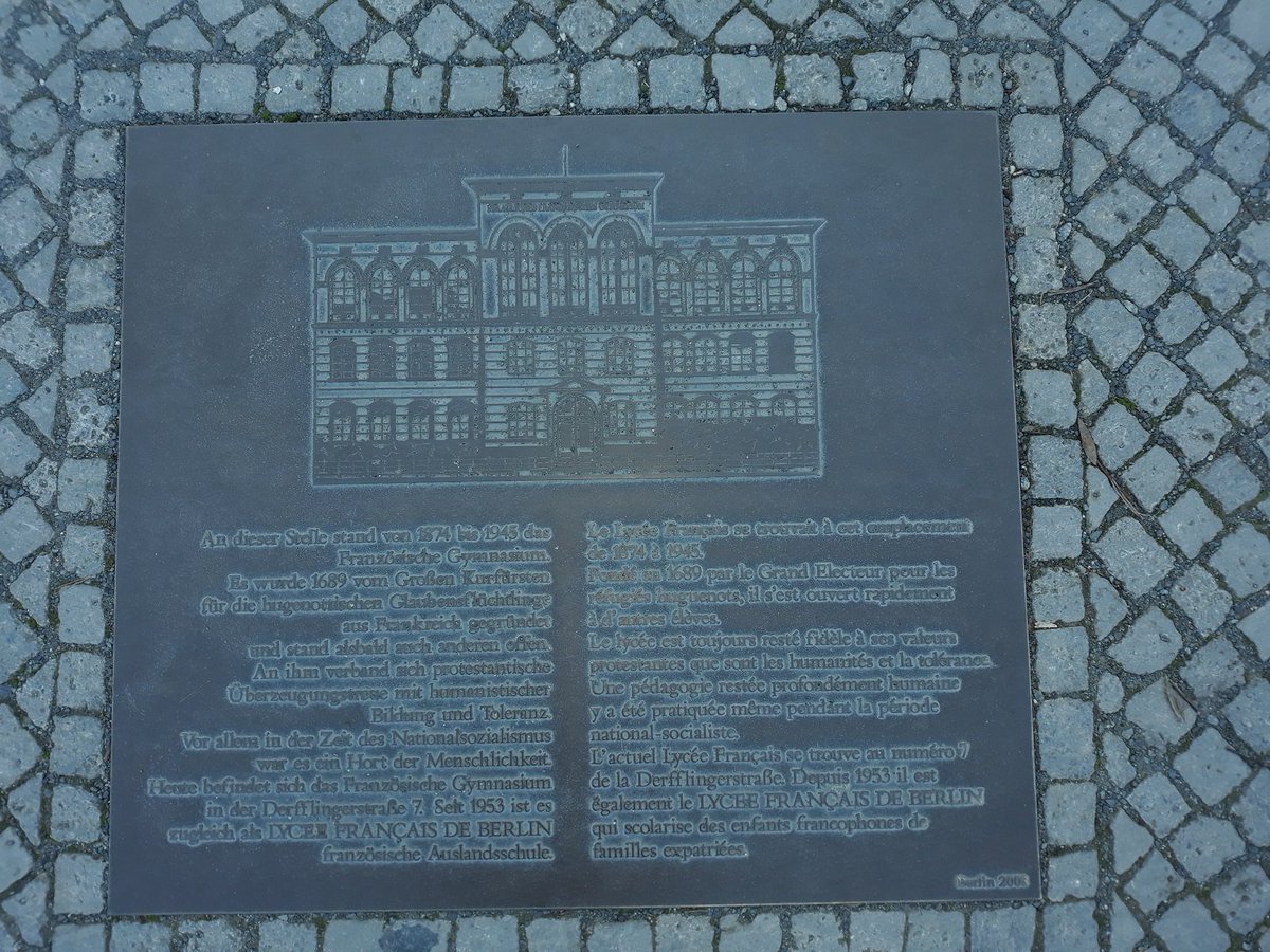 18a\\ From 1874 until 1945 the French Gymnasium was located at a much nicer spot at the Reichstagufer next to the river spree. This spot is commemorated by a plaque. Judging by the drawing on this plaque, it used to be housed in a much nicer building as well, which was destroyed.