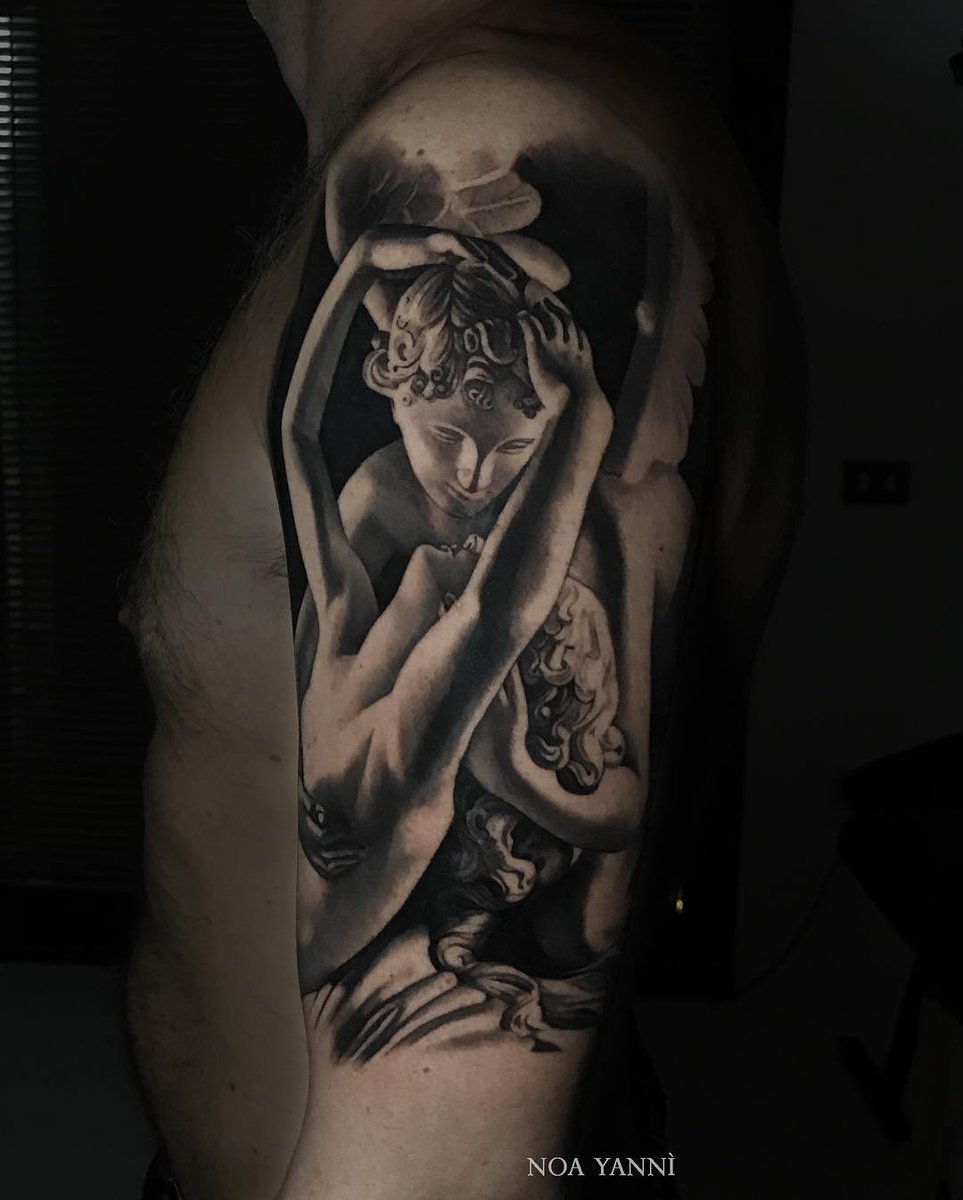 Psyche Revived by Cupids Kiss tattoo on the lower back