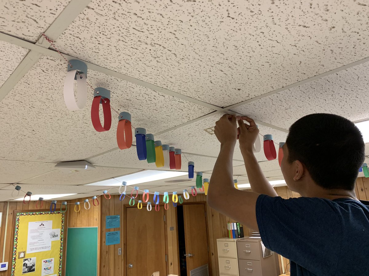 gerardmath's tweet photo. Student hanging paper Christmas lights to brighten the classroom. #IandGcenter https://t.co/p4pKZUDwvw