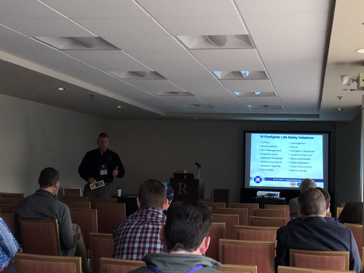 TippettJohn's tweet photo. NFFF @iawf Safety Summit, Asheville. Tom Harbour & Rick Best engaging Safety Summit attendees on “making the two worlds one.” Whether blue shirt or yellow shirt, human behavior & human factors don’t vary. #itsallabouthumans @NFFF_News @IAFC_SHS @EGH_Program @BillyGoldfeder https://t.co/5lKwE51sXW