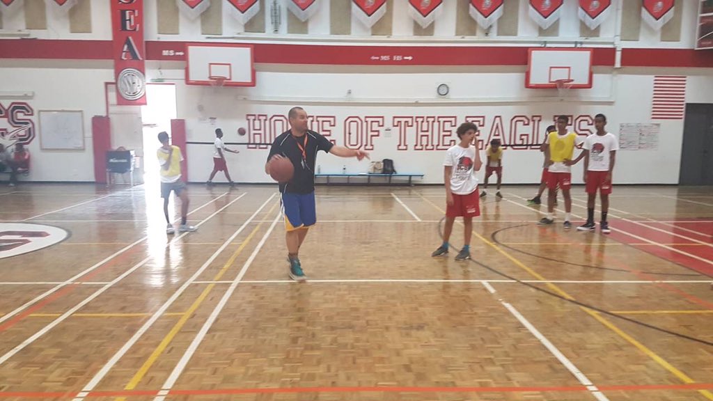 Coach chad is reviewing their most important play, which is called flex. Flex is an offensive play that confuses the opponents so that we can find an open lane to the basket. This is a smart play for more points. #icsaddis #ics 
 By:Yanet
