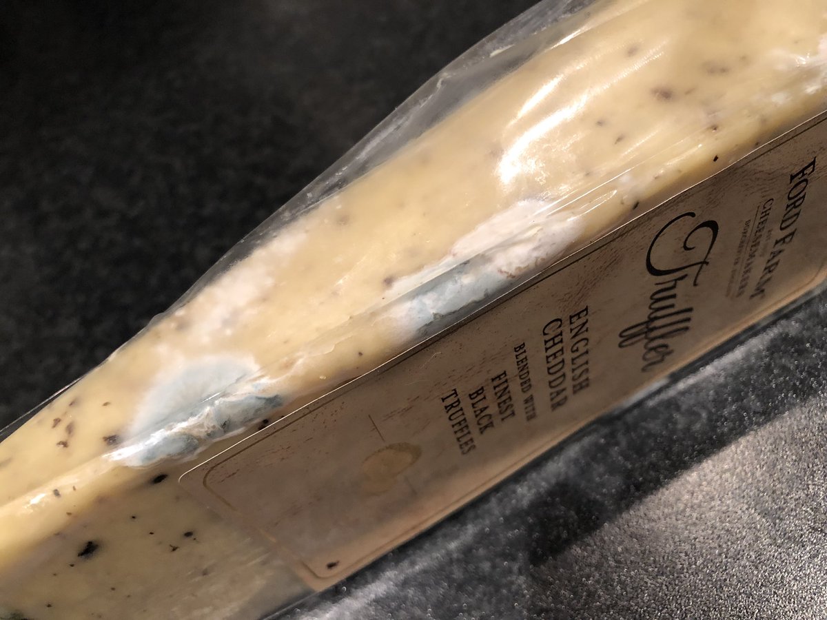 MathsShannon's tweet photo. @CostcoUK I’m very disappointed in my Christmas cheese purchase! It has been in fridge unopened and just noticed this has happened ☹️ https://t.co/VHsGwevoyB