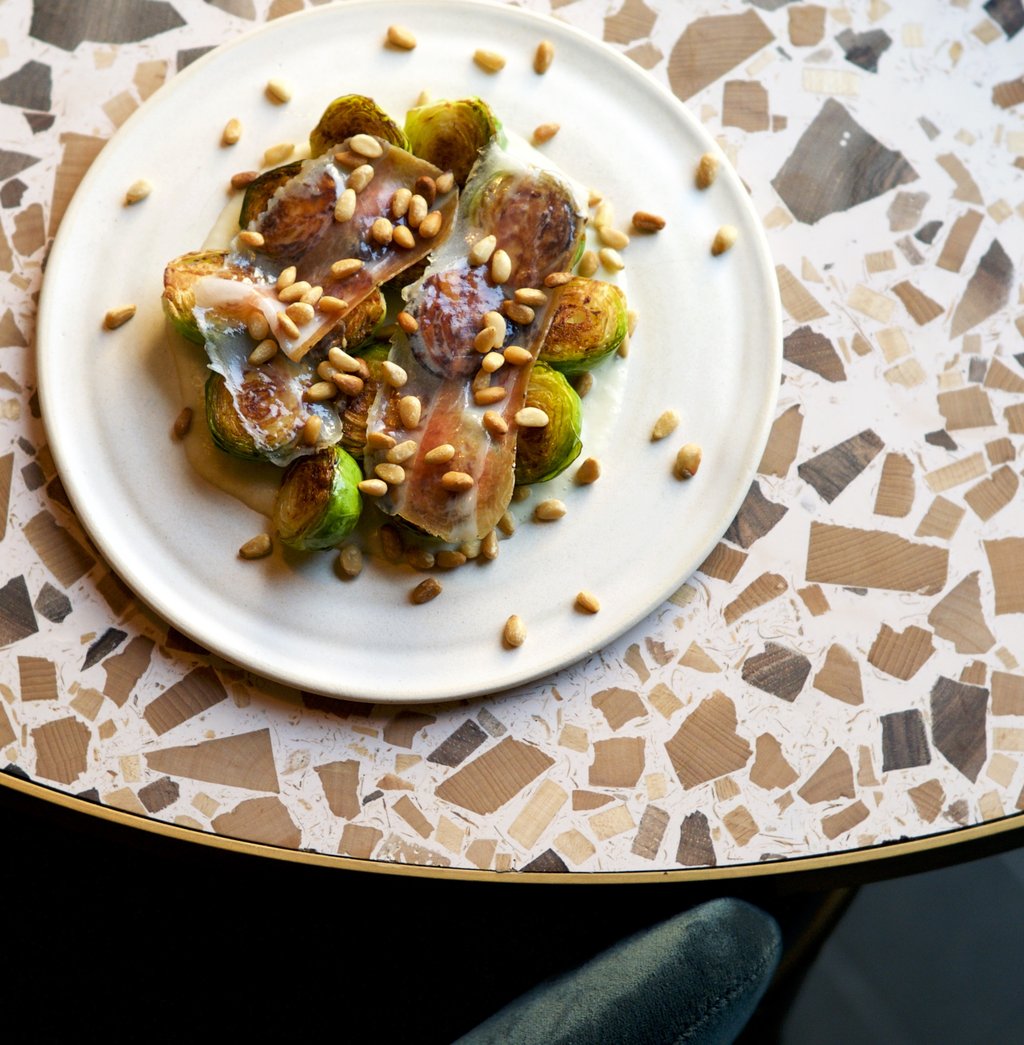 #Sprouts, onions, lardo, pine nuts.  

Thanks @natoora