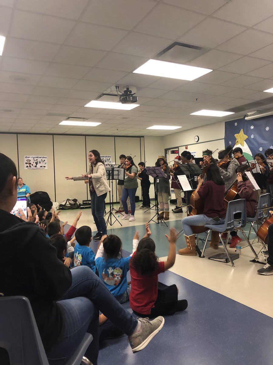CoachT_AMS's tweet photo. Our awesome conductor and her little conductors-in-training at pierce! @AMSOrchestra1 @Austin_Broncos https://t.co/0lw5H2CZIK