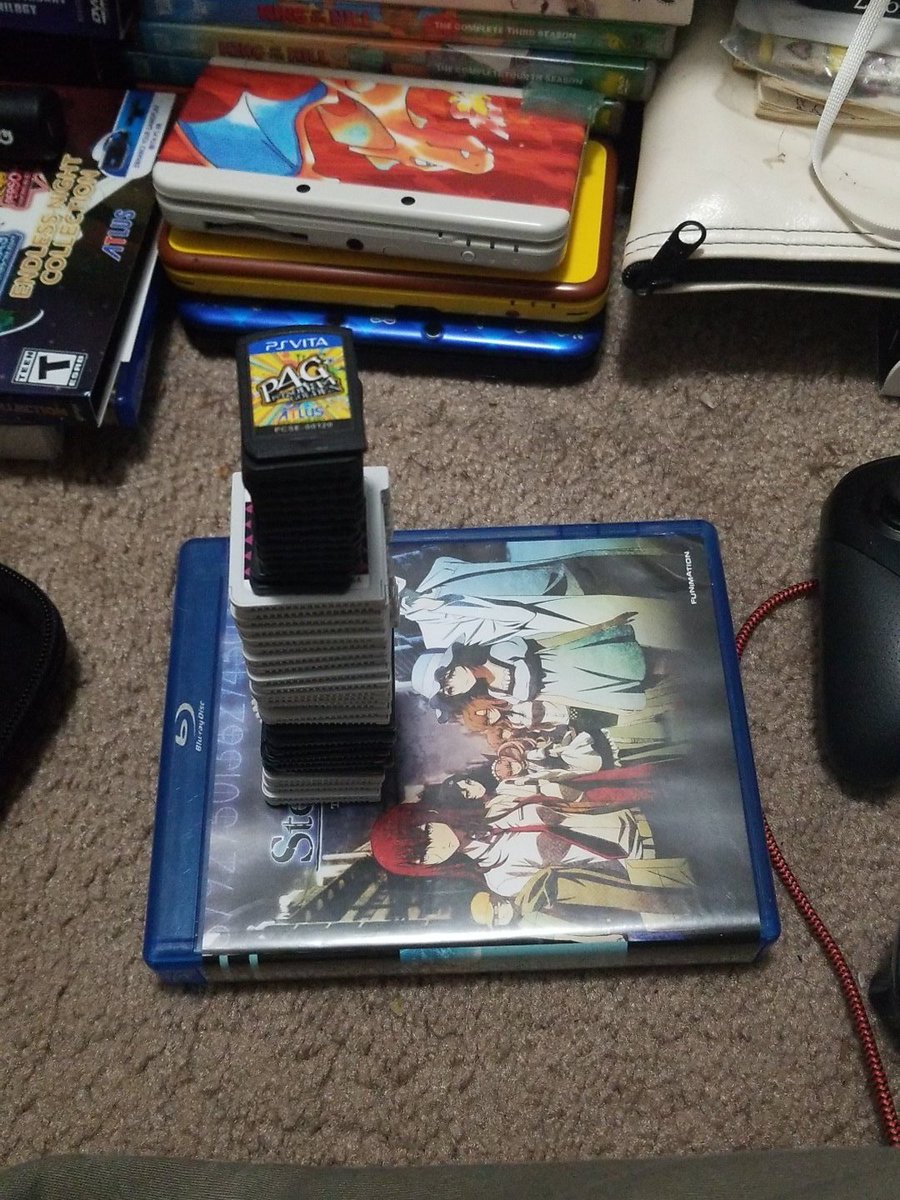 HappyEndings666's tweet photo. When you get so bored you start playing Jenga with video game cartridges. #bored #LateNight #gaming https://t.co/V92xjEC7tQ