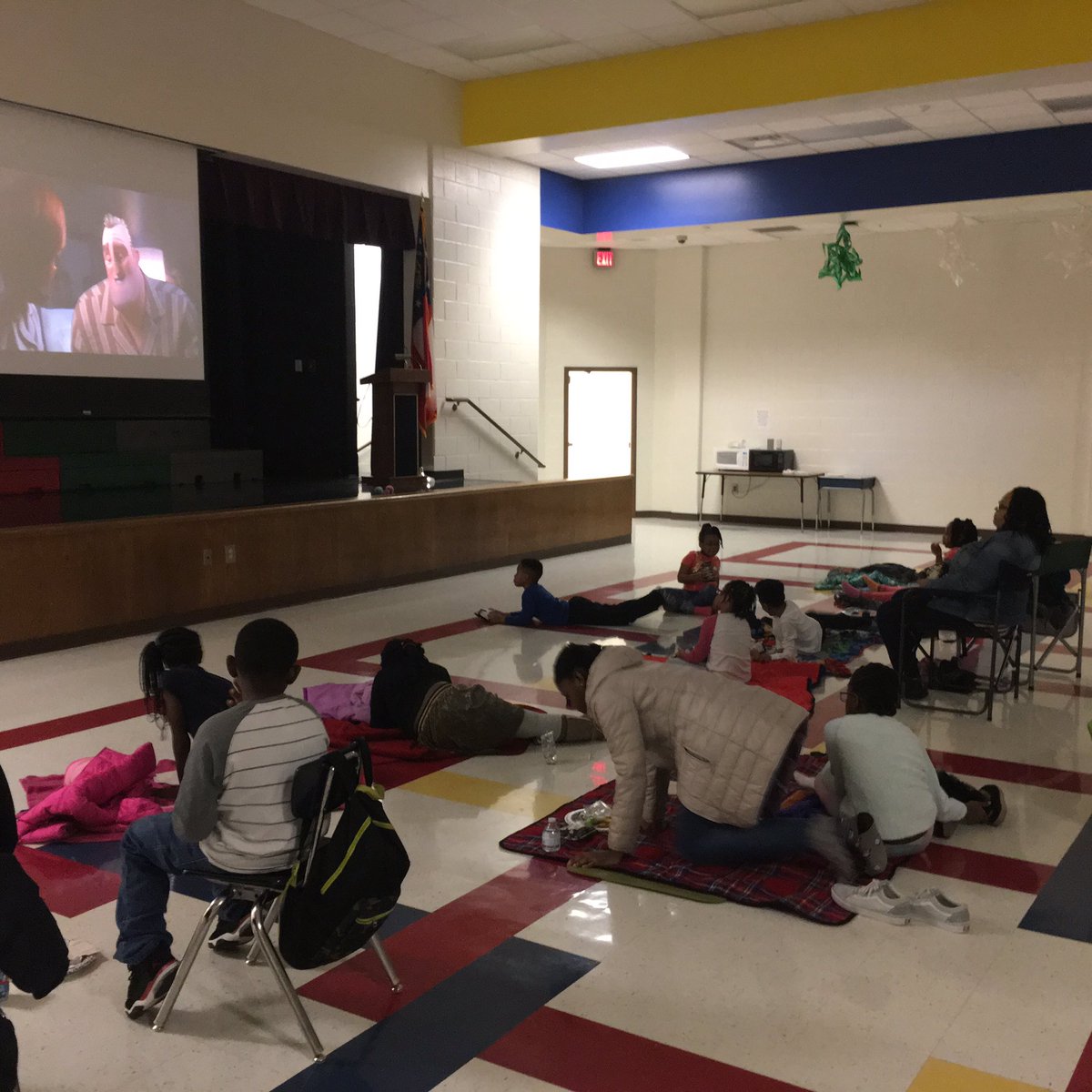 ‪Enjoying our new projector purchased by PTA at out PTA Movie Night! ‬