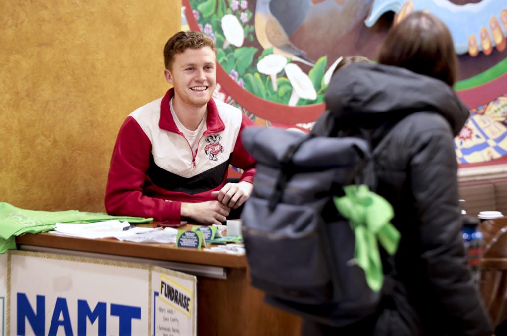 WiStateJournal's tweet photo. How lime green bandanas brought a suicide prevention campaign to UW-Madison's campus https://t.co/ahSuzW73Ms https://t.co/IJhk4kTQVD