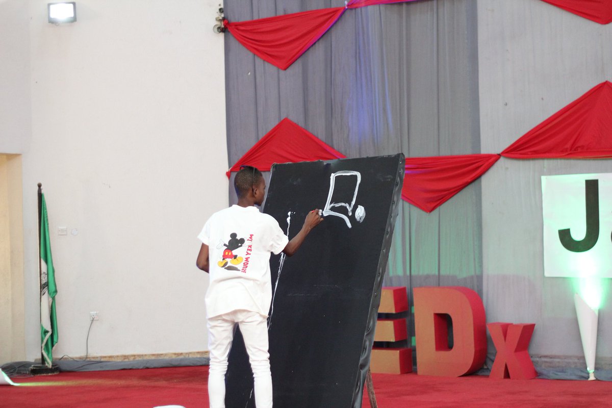 TEDxJalingo's tweet photo. Amazing Ibrahim Mohammed doing his painting at #TEDxJalingo 
#ANewWave https://t.co/2Ttp8XY581