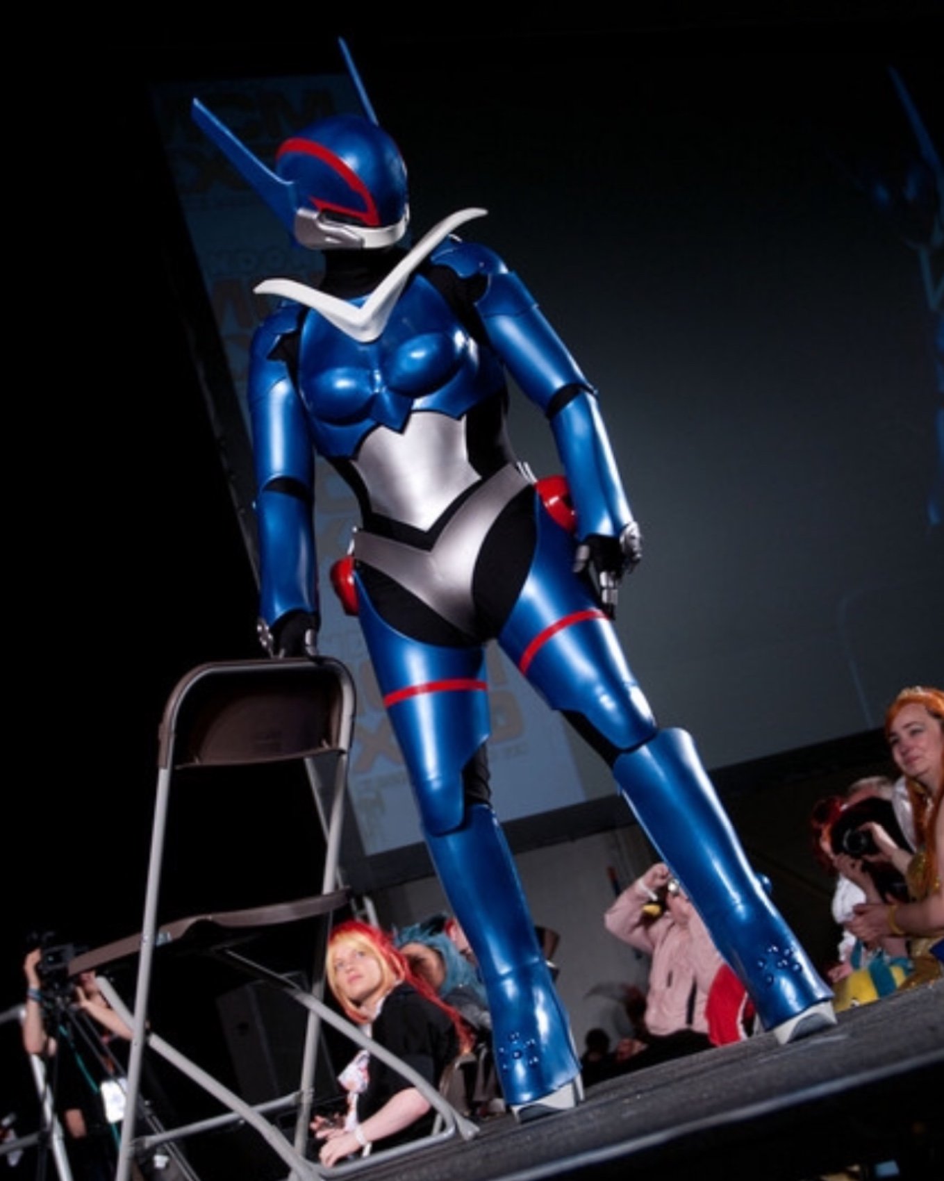 A cosplay of Priss in powered combat armor from the anime "BubbleGum Crisis"