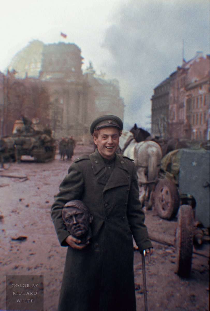 rwhitecolor's tweet photo. Soviet Red Army soldier Yevgeniy Dolmatovasky shows off the bust of Adolf Hitler that he looted from the ruins of Berlin, May 1945 #history #ww2 #wwii #worldwar2 #colorized #colorization https://t.co/2kZjEoeie9