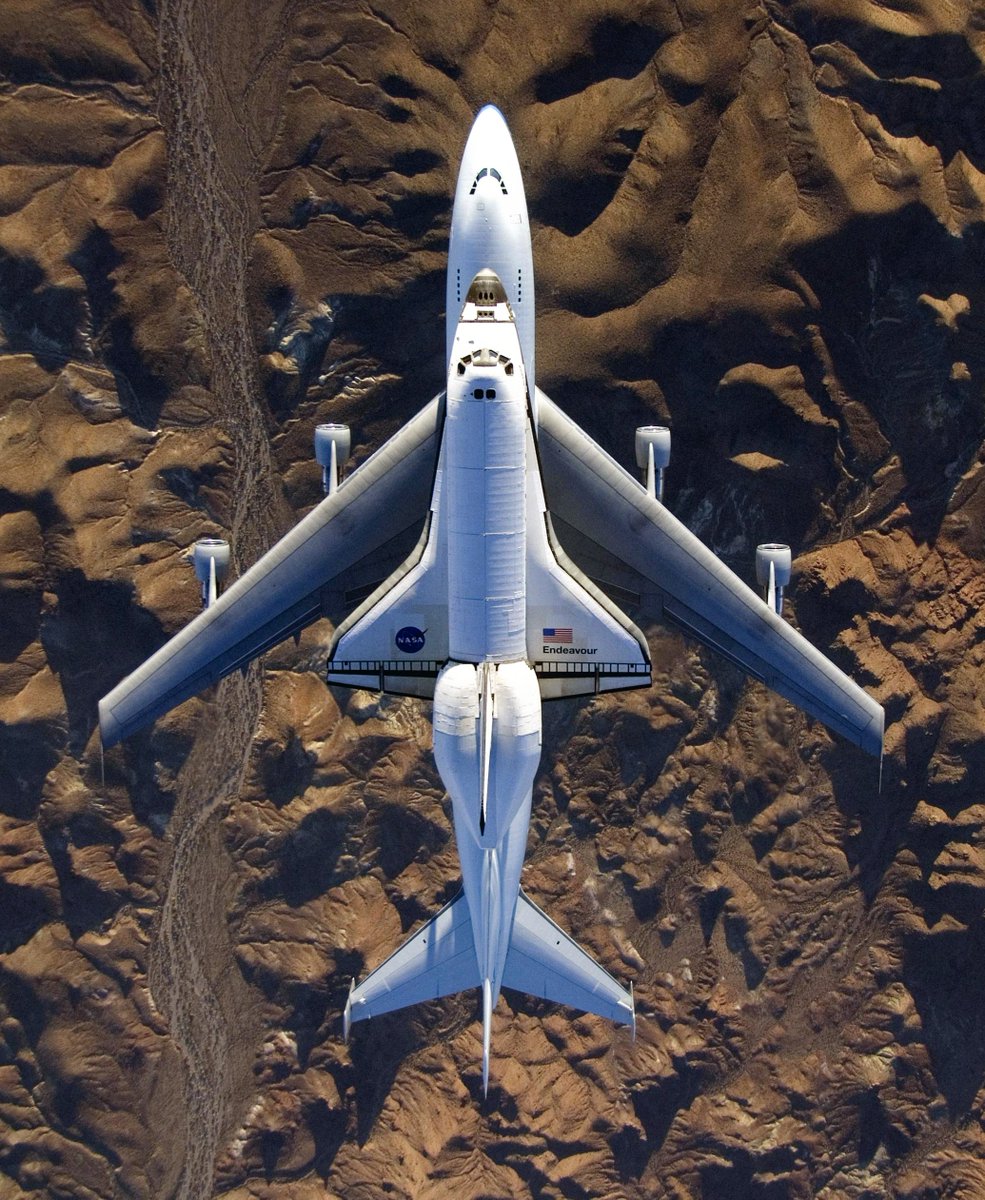 Aviation_Intel's tweet image. One of the coolest shots ever taken of the Shuttle Carrier Aircraft and the Orbiter mated up and airborne. Shot by NASA photog Carla Thomas inverted in a Hornet I believe. The folks at Armstrong Flight Research Center were pretty proud of this one the last time I was down there.
