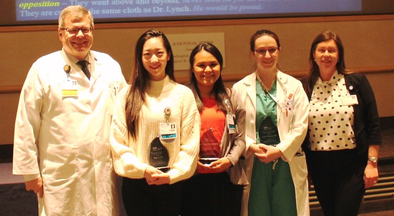 Hospital President Gregory Argyros, MD, with Hope Lu, RN; Judith Valdez, RN; Laura Johnson, MD; and Norine McGrath, MD, director, the John J. Lynch, MD, Center for Ethics at the Awards ceremony