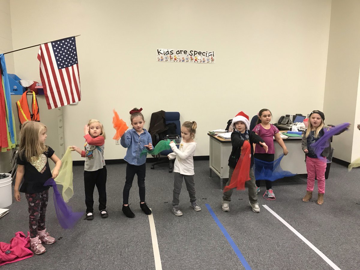 Kinder's making their scarves dance to the beat and rhythm of Waltz of the Sugar Plum Fairies in music class.