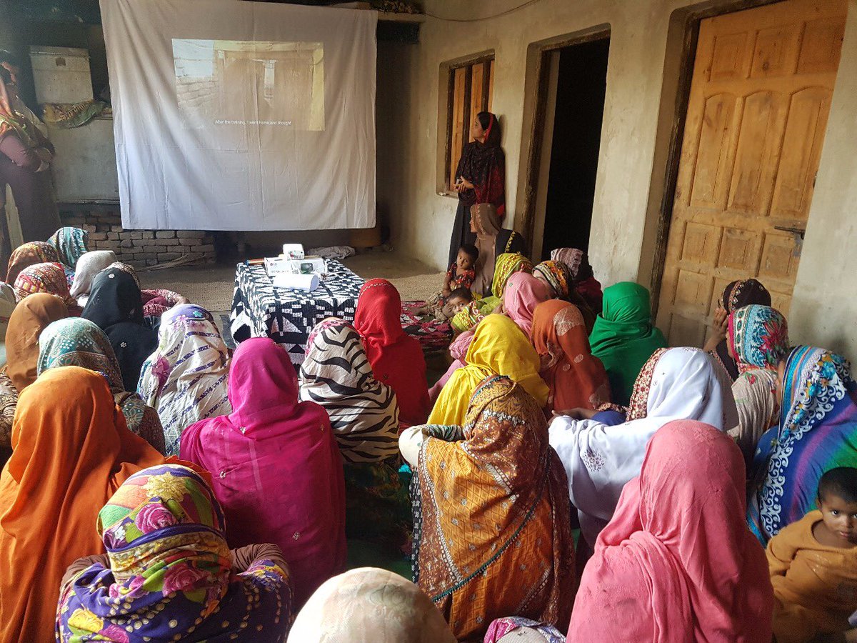 rwaqar's tweet photo. Our teams screening stories of most significant change in rural Sindh. Community members are gathered from different villages & shown participatory videos made by mothers, aiming to trigger community dialogue on barriers & pathways for Behavior change #SBCC #behaviorchange #PVMSC https://t.co/G0akmLDJD5