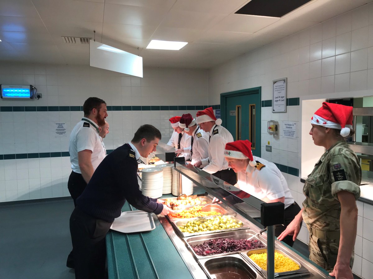 HMS_Raleigh's tweet photo. Last night was Christmas dinner for the recruits, phase two trainees and ship’s company junior ratings, served in true Naval tradition by the Officers serving at HMS Raleigh #christmas #yulethewaves https://t.co/1QGEDsC2ps