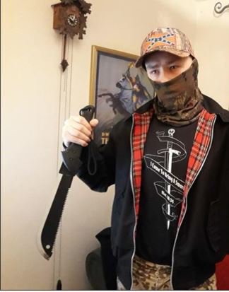 CPSUK's tweet photo. Six people, including a couple, who were active members of a banned neo-Nazi group that glorified Hitler and the Third Reich have been jailed today https://t.co/v2UjYq0dkw. PHOTO: Adam Thomas posing with a machete and cushions found in the home he shared with Claudia Patatas https://t.co/12TgdDSX8E