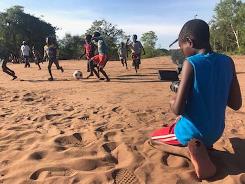 Make Your Own Ball day and Banda Bola Sports foundation . A Child at Chituka Village in Malawi filming his friends playing soccer.#keepingbothboysandgirlsinschool#Righttoplay