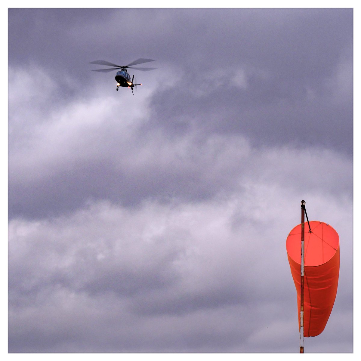 RedhillARFFS's tweet photo. Pretty gusty! AW109 G-ZIPE making an approach for the 18 numbers. https://t.co/8OIaEMlNjL