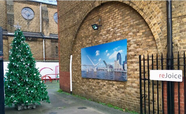 #reFormArchitects office yard - reJoice! The tree is up &amp; looking good, especially with the backdrop of ours &amp; <a href="/ElliottWood_/">Elliott Wood</a> s design for #RotherhitheBridge ! 
 #LondonChristmas #Southwark #SeasonsGreetings #Rotherhithe #SE1 #SE16
#RotherhitheBridge
#NotjustanyRotherhitheBridge
