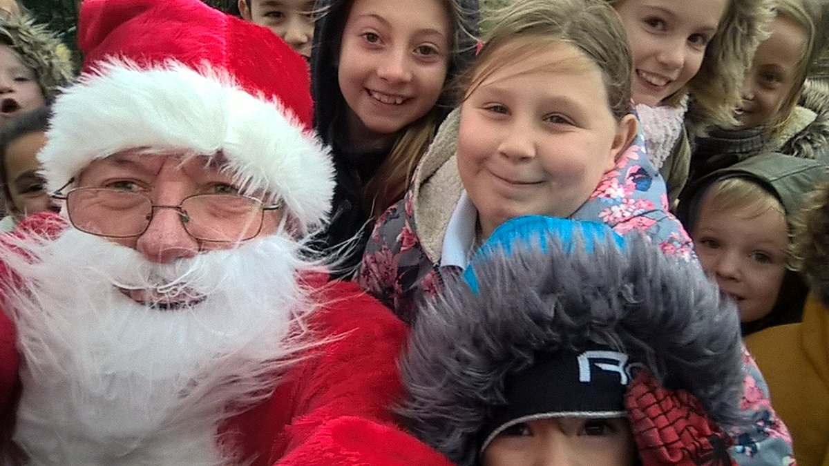 Father Christmas in Guernsey enjoying <a href="/_thedailymile/">The Daily Mile UK</a> and doing a selfie at St Mary St Michael school