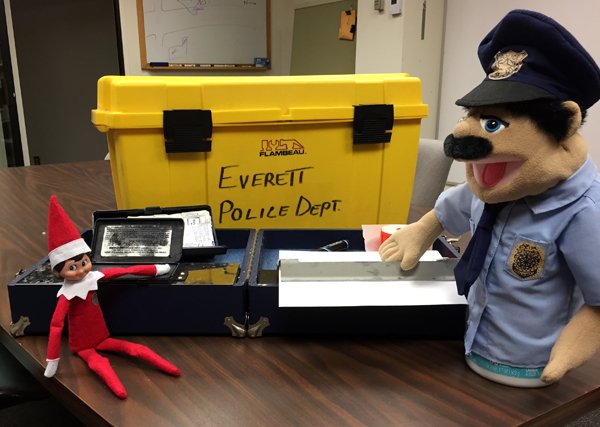 EverettPolice's tweet photo. Cuffs the #ElfOnAShelf is answering serious questions about his whereabouts yesterday as Major Crimes Unit detectives work overtime to get him to talk… Was he at the Everett Fire Station??? Book ‘em, Danno! #FindCuffs https://t.co/phGnZWi3GB