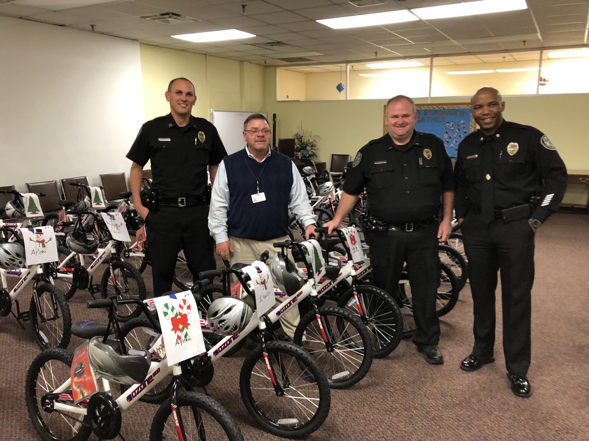 GSO_Police's tweet photo. The Greensboro Police Department in partnership with Academy Sports and Guilford Child Development we were able to give away 60 bikes.  The bikes were given to families that are involved with the Guilford Child Development. Thanks to everyone who made this possible for these kids https://t.co/qopAMshr5C