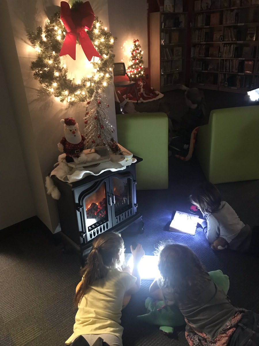 mellyherbs's tweet photo. Reading in the Dark...one of our favorite pre-holiday activities! Getting to read anywhere=legs sticking out from under my desk. We had a mom volunteer to shelve books in the dark with her flashlight, what a great sport with a sense of humor! #librariesinrisd #RISDConnects https://t.co/xTDPO2VGiL