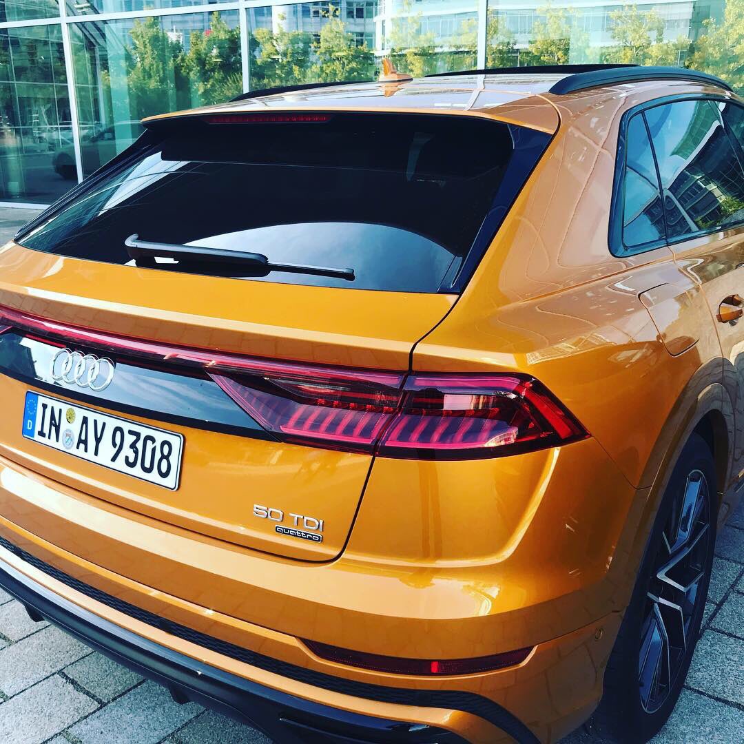 JezzaMaqasa's tweet photo. Here I was minding my business in #Ingolstadt home of @AudiOfficial , I met up with two beautiful and aggressive looking SUV/Coupes, #AudiQ8 in the #50TDI Quattro guise. The Dragon Orange color stands awesomely in these well sculptured wheels. Come 2019 @audisouthafrica #Q8 https://t.co/FZxZEJ6IsC