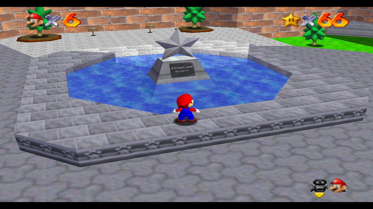 mario processes down a long hallway into a courtyard. this is mario moving into a special niche altar, usually located in a certain cardinal direction set aside from the main temple. he is in the shadow behind the castle, and in the center of this courtyard is this sculpture: