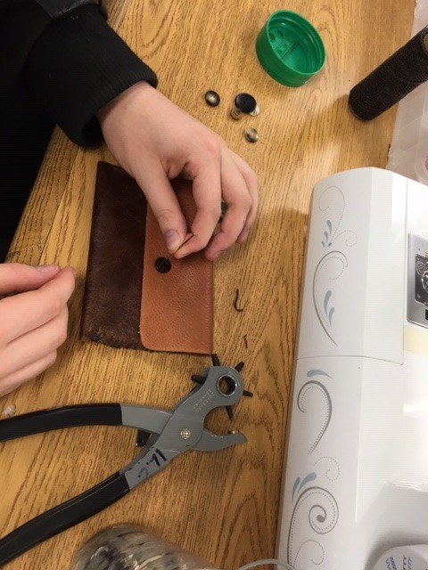 BeckyStouten's tweet photo. Sam got out the leather making tools and made a wallet, Zach is proud of his pillow :) #mnitem, #essalibraries https://t.co/FA1Vb8qk8j