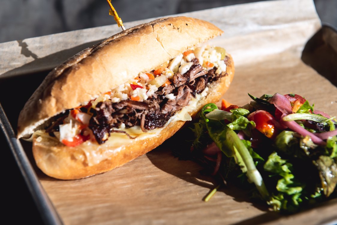 A hearty Italian Beef Sandwich [@44farms sliced chuck,gruyere, relish, garlic mayo, hoagie] &amp; your favorite coffee drink are the cure-all after a long night of celebration.  We’re here for you today through 4 p.m., &amp; for the new year ahead 🎉
 #RevivalMarket #AgricoleHospitality