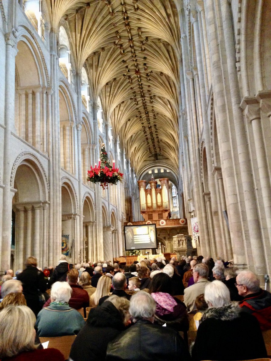 asanderson197's tweet photo. A very full #audience was assembling for @Nrw_Cathedral's #organ #recital, & a big #TV screen would show us the #organist's hands. The #PeaceAngel which long hung from the #vault has made way for a #floral-themed arrangement hanging from there. https://t.co/onES0t1uTz