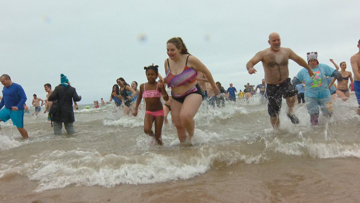 fox11news's tweet photo. More than 100 people decided to splash into the new year for the #Jacksonport Polar Bear Plunge: https://t.co/tgQAYyACuP https://t.co/pV8jNVmnzH
