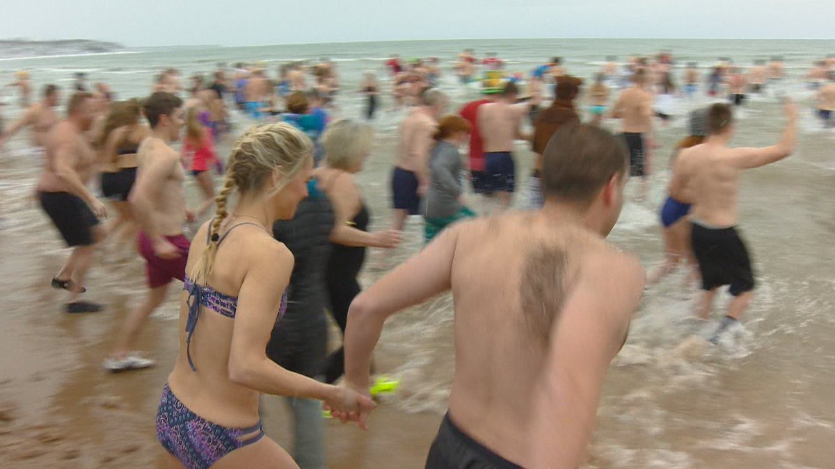 fox11news's tweet photo. More than 100 people decided to splash into the new year for the #Jacksonport Polar Bear Plunge: https://t.co/tgQAYyACuP https://t.co/pV8jNVmnzH