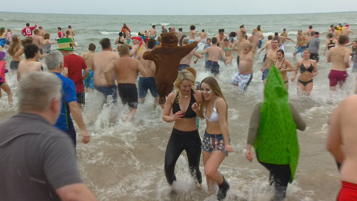 fox11news's tweet photo. More than 100 people decided to splash into the new year for the #Jacksonport Polar Bear Plunge: https://t.co/tgQAYyACuP https://t.co/pV8jNVmnzH
