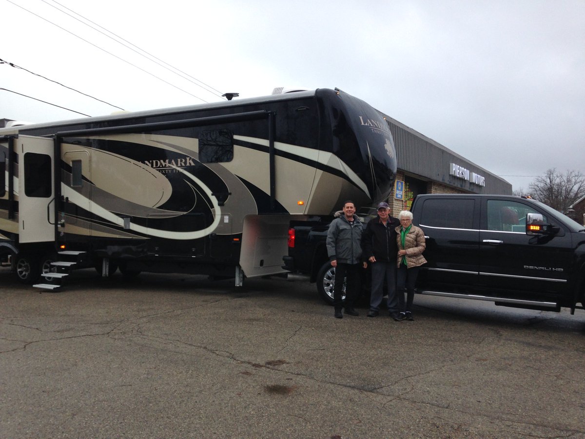 Happy New Year from all of us at <a href="/PiersonMotors/">Pierson Motors</a> 
These happy customers picked up their new truck and trailer just before Christmas.  We're confidant they will have a fabulous year making memories.  Let us help you make some. Year end pricing at  piersonmotors.ca